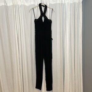 Bebe Black Sleeveless Choker Style Jumpsuit Lace Up detail with beading Size S